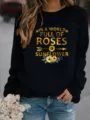 Dames casual sweatshirt met lange mouwen en ronde hals met zonnebloem citaat opdruk. - S / Tops / Zwart
