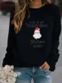 Christmas printed crewneck sweatshirt detail showing Santa graphic and seasonal text. - Black