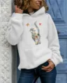 Detailed shot of a casual women's grey hoodie featuring an artistic colorful cat print. - S / Tops / White