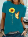 Casual dames teal korte mouw t-shirt met een mooie zonnebloem en vlinder grafische print. - S / Tops / Helder Blauw