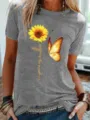 Gedetailleerd overzicht van een grijze T-shirt met korte mouwen en zonnebloemprint. - S / Tops / Grijs