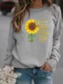 Gros plan sur le sweat shirt gris a manches longues avec tournesol et impression. - S / Hauts / Gris