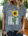 Detailed view of heather grey short sleeve t-shirt with American flag sunflower graphic. - S / Tops / Gray