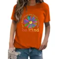 Detailed view of the casual orange short sleeve t-shirt featuring vibrant daisy graphic print. - S / Tops / Orange