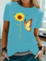 Lichtblauwe dames korte mouw T-shirt met zonnebloem en vlinder print kleurvariant. - S / Tops / Lichtblauw