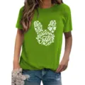 Detailed view of the green short-sleeve t-shirt featuring festive easter bunny graphic print. - S / Tops / Fruit Green