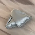 Exquisite silver satin triangle hair clip detail featuring crystal beads and metal tag. - Blue