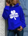 Blue women hoodie featuring white lucky clover graphic and long sleeves apparel detail shot. - Sapphire Blue