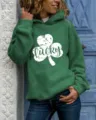 Green long-sleeve pullover hoodie featuring a white lucky shamrock graphic detail. - Green