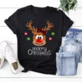 Christmas reindeer graphic black t-shirt detail showing cute cartoon deer and lettering. - S / Tops / Black