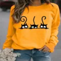 Lockerer Damen Langarm Pullover mit süßem schwarzem Katzen Druck für Herbst und Winter. - Gelb