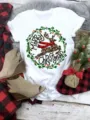 Christmas short sleeve white t-shirt with cute reindeer graphic print for women holiday wear. - S / Christmas Reindeer Wreath (QLO31120) / White
