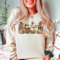Cozy Christmas graphic long sleeve crewneck sweatshirt featuring cute holiday gingerbread print. - S / Tops / Khaki