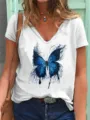 Close-up detail of women's white V-neck short sleeve t-shirt with striking blue butterfly print. - S / Tops / White