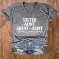Detailed close-up view of casual grey V-neck short sleeve graphic print t-shirt and denim shorts. - S / Top (V1) / Gray