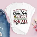 Close up detail of white t-shirt featuring Christmas holiday text print festive design. - 3XL / Tops / Elf Movie Quote Print