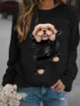 Vista detallada de una sudadera negra de felpa con un tierno gráfico de cachorro en 3D. - S / Tops / Negro