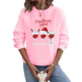 Detailopname van roze sweatshirt met lange mouwen en kerstthema met een feestelijk wijnglasontwerp. - S / Tops / Roze