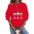 Close-up detail van het rode sweatshirt met lange mouwen en ronde hals met kerstwijnglasgraphic. - S / Tops / Rood
