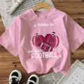 Pink short sleeve T-shirt with cute pumpkin football graphic, casual graphic tee for women. - S / Tops / Pink