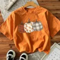 T-shirt à manches courtes imprimé citrouille d'Halloween orange, haut décolleté d'automne. - Orange