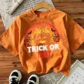 Halloween orange short sleeve T-shirt for women, casual festive graphic top with pumpkin print. - Cotton Orange