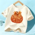 Kids Halloween short sleeve t-shirt, sparkly orange pumpkin graphic, cute holiday top. - Cotton Apricot