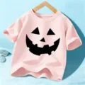 Kids pink short sleeve t-shirt with Halloween pumpkin face print for boys and girls festival wear - 110cm / Pink