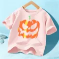 Kids pink short sleeve t-shirt with spooky Halloween pumpkin graphic for children daily wear. - 110cm / Pink