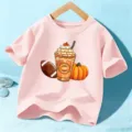 Kinder rosa Kurzarm T-Shirt mit Halloween Kürbis Gewürz und Football Grafik Aufdruck. - 110cm / Baumwolle Rosa
