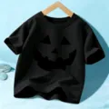 Kids Halloween black short sleeve t-shirt with fun pumpkin face graphic for boys and girls. - 110cm / Black