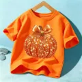 Kids Halloween orange short sleeve t-shirt with sparkly pumpkin graphic, comfortable daily wear. - Cotton Orange