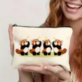 Canvas zipper pouch featuring cute red panda cartoon print, ideal for daily makeup and travel storage. - Style 7