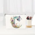 Canvas cosmetic makeup bag with elegant watercolor floral butterfly letter C design for women. - Letter C