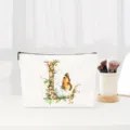 Floral letter L canvas makeup bag detailed view, elegant cosmetic pouch for daily use. - Letter L