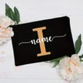 Customized floral alphabet black canvas cosmetic pouch with delicate peony and leaf background decor. - Letter I