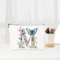 Detail shot of the elegant watercolor floral letter M cosmetic bag close-up view. - Letter M