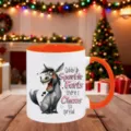 Detailed shot of a ceramic coffee mug with funny donkey print and cozy holiday background setting. - Orange Red
