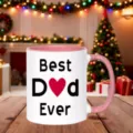 Gros plan d'une tasse en céramique blanche avec poignée rose et imprimé d'amour Best Dad. - Rose