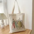 Bolso tote de lona con estampado gráfico de libros florales para compras diarias. - Blanco Roto