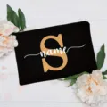 Custom letter black makeup bag with floral background, stylish cosmetic pouch for women. - Letter S