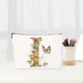 Floral letter canvas makeup pouch, elegant cosmetic storage bag for travel and daily use. - Letter I