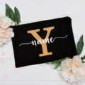 Custom black floral canvas clutch bag detail, showing elegant white flower decoration and letter. - Letter Y
