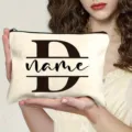 Custom letter canvas cosmetic bag with zipper, personalized initial D design for daily travel. - Letter D