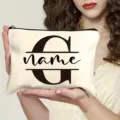 Custom initial canvas makeup pouch detail view, portable zipper bag with personalized letter print. - Letter G