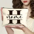 Canvas makeup bag with custom letter monogram design, portable zipper pouch for women. - Letter H