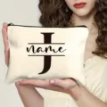 Custom canvas makeup bag with stylish letter print, portable zipper pouch for daily travel use. - Letter J