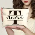 Detailed view of custom canvas cosmetic bag, portable zipper pouch with letter print. - Letter T