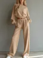 Detailed view of the casual solid color cropped sweatshirt and wide-leg trousers set. - Khaki
