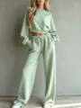 Detailed view of light green casual cropped sweatshirt and wide-leg lounge pants set. - Light Green
